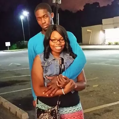 Image: Two charged for staging robbery of parking garage, taking money