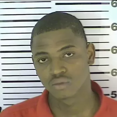 Image: Gang suspect surrenders; two more sought