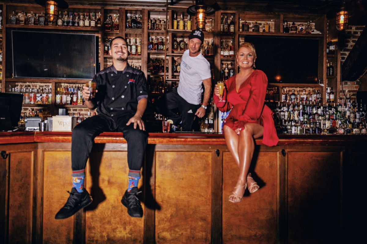 Alternate photo from this year’s cover shoot, with (l-r) Chaz Ortiz (Chazito’s Latin Cuisine) Mark Lebos (Strong Gym), and Kris Allred (WSAV), at Congress Street Social Club.