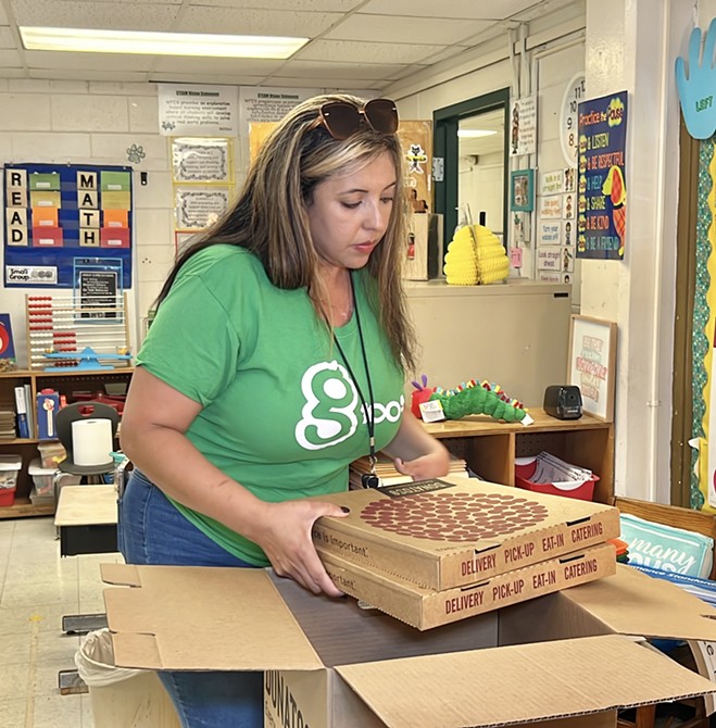 G100, Step One Auto and Donatos Surprise Windsor Forest Elementary Teacher Cynthia Davis with Pizza Party