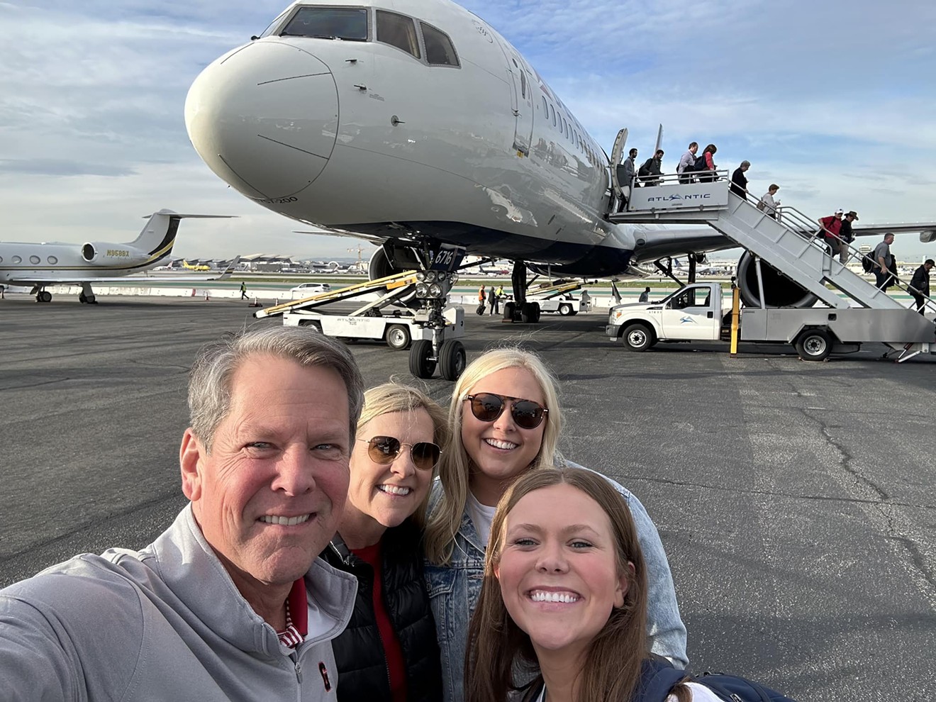Brian Kemp posted this photo to his Facebook page with the caption "Marty, the girls, and I just landed in California for the #NationalChampionship. First thing we’re going to do is find a spot to tailgate with the best fans in the country!"