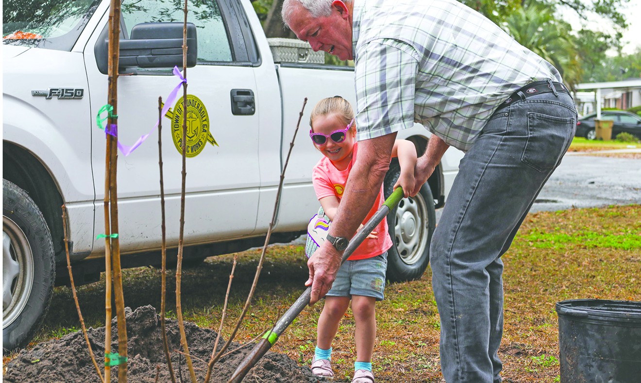 Thunderbolt Councilman James Lauvin and Rayna Parmer plant a tree during Georgia Arbor Day.