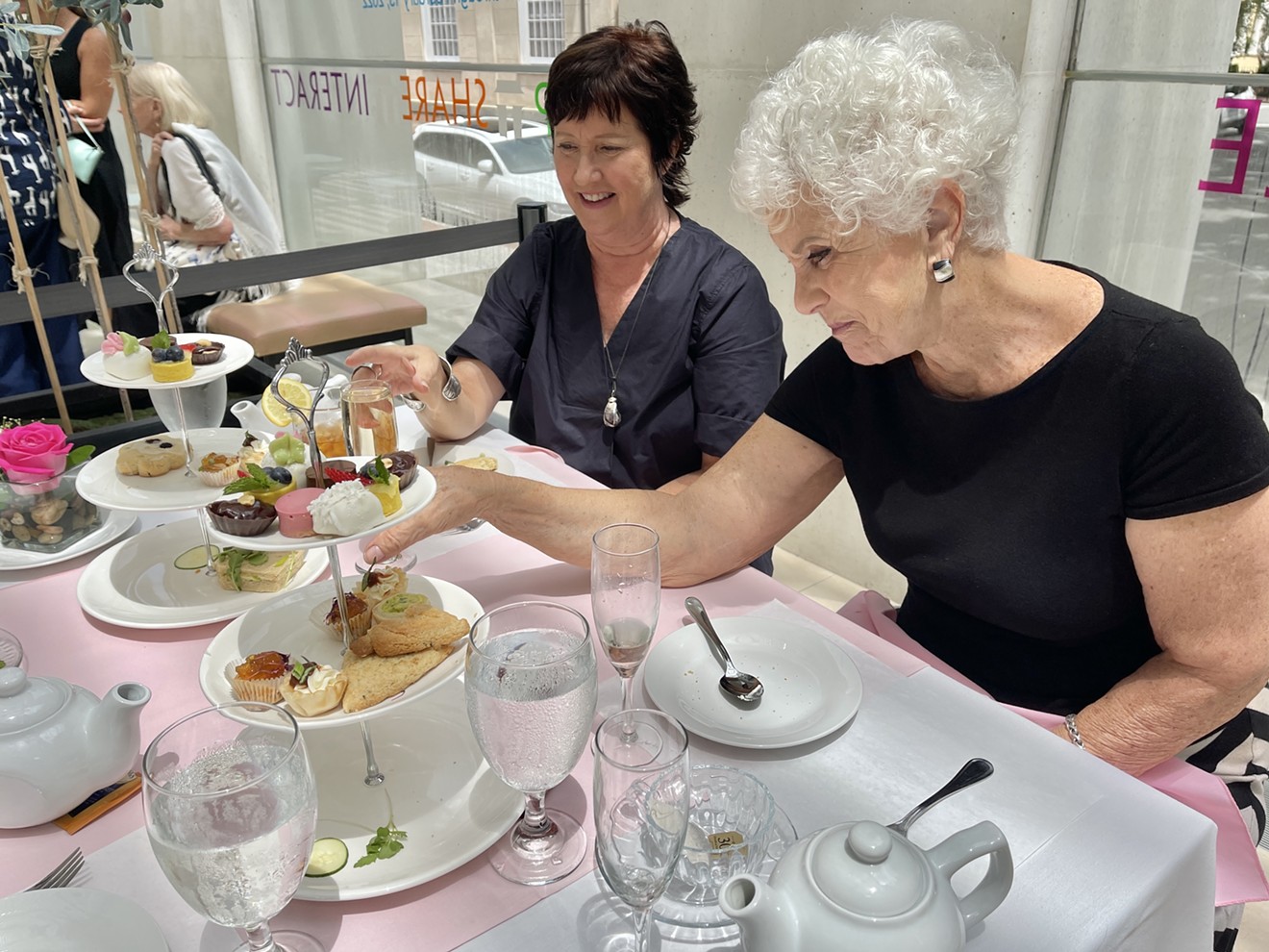 Guests help themselves to some tea time snacks during Afternoon Tea at Joe’s at the Jepson July 21 at the Telfair’s Jepson Center for the Arts.