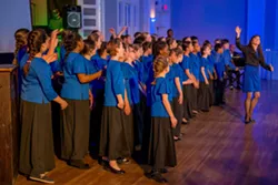 Roger Moss, Savannah Children's Choir lead the Lighted Christmas Parade