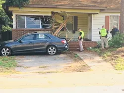 Car hits house on DeRenne